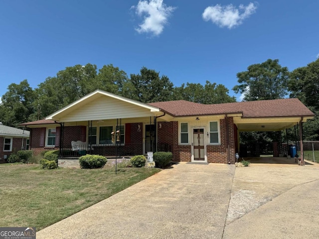 single story home featuring a carport, covered porch, and a front yard