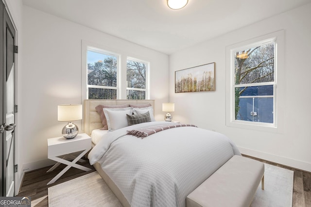 bedroom with hardwood / wood-style floors