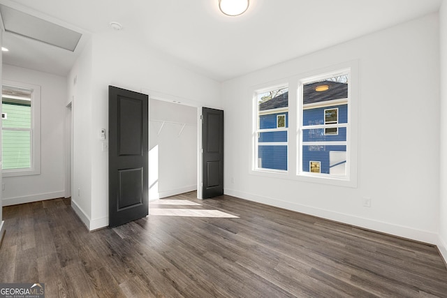 unfurnished bedroom featuring dark hardwood / wood-style floors