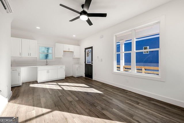 kitchen with white cabinetry, sink, ceiling fan, and dark wood-type flooring