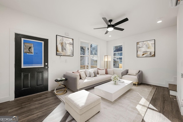 living room with hardwood / wood-style flooring and ceiling fan