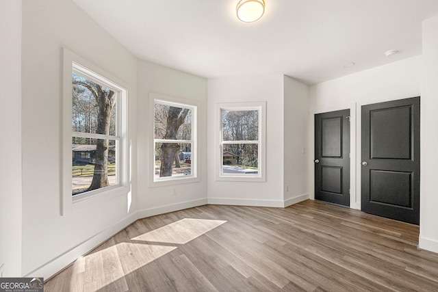 unfurnished bedroom with hardwood / wood-style flooring