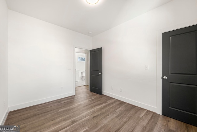 unfurnished bedroom featuring hardwood / wood-style floors