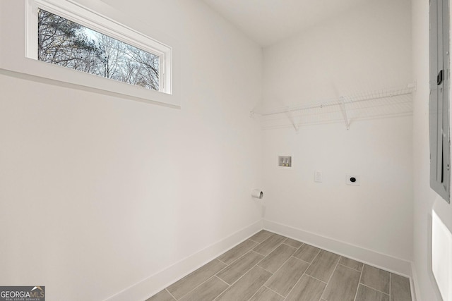 clothes washing area with hookup for an electric dryer and hookup for a washing machine