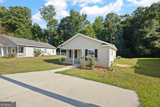 view of front of home with a front yard and covered porch