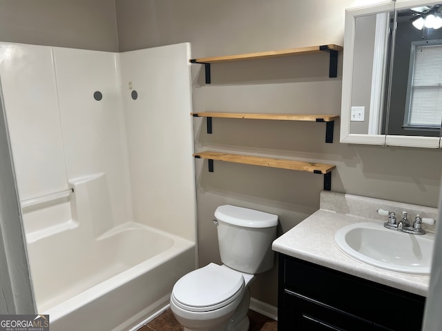 full bathroom featuring shower / bath combination, toilet, and vanity