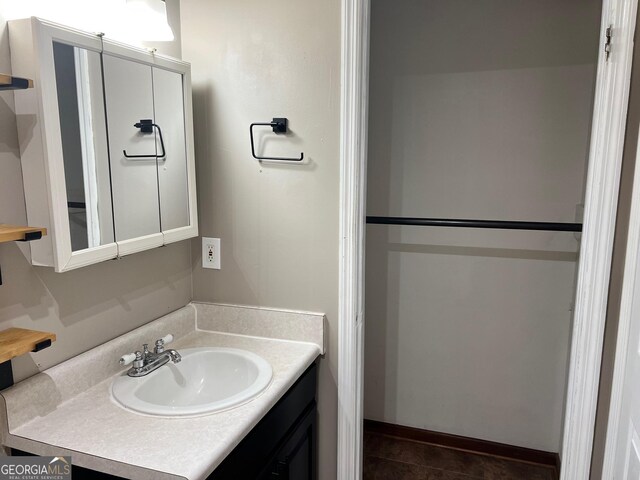 bathroom with vanity and tile patterned floors