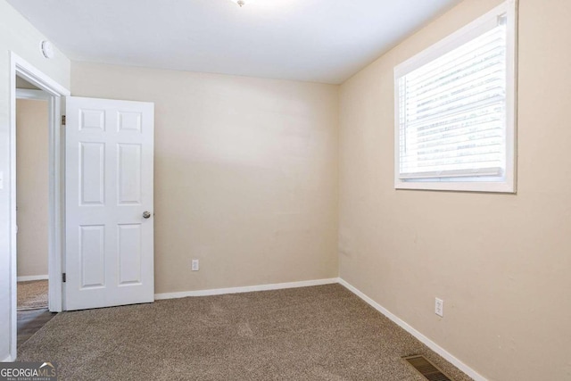 spare room with carpet