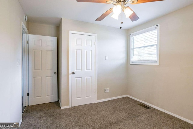 unfurnished bedroom with carpet flooring and ceiling fan