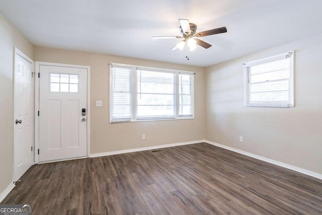 foyer entrance with ceiling fan and dark hardwood / wood-style flooring