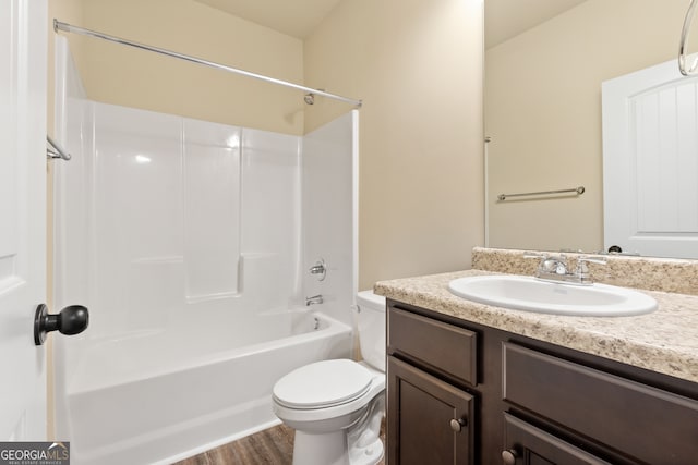 full bathroom with vanity, toilet, hardwood / wood-style flooring, and shower / bathing tub combination