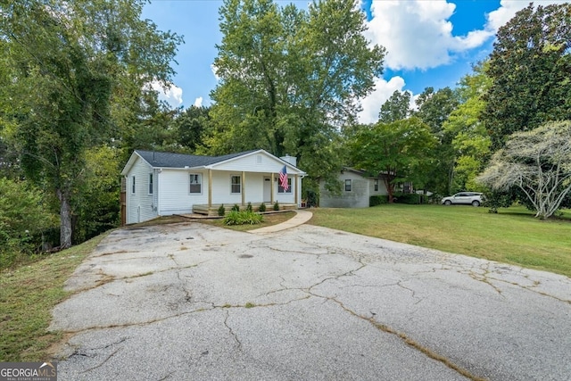 view of front of home with a front lawn and a porch