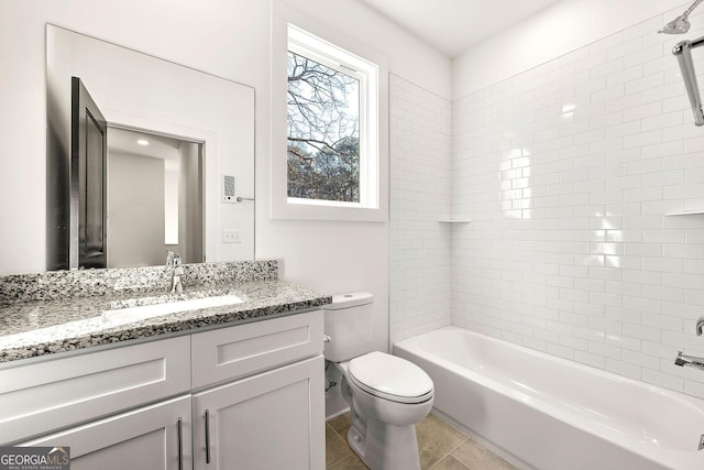 full bathroom featuring tile patterned floors, vanity, toilet, and tiled shower / bath