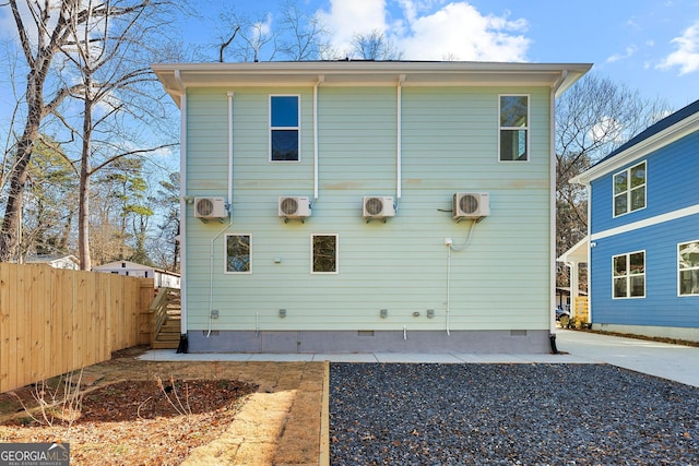 back of property featuring ac unit