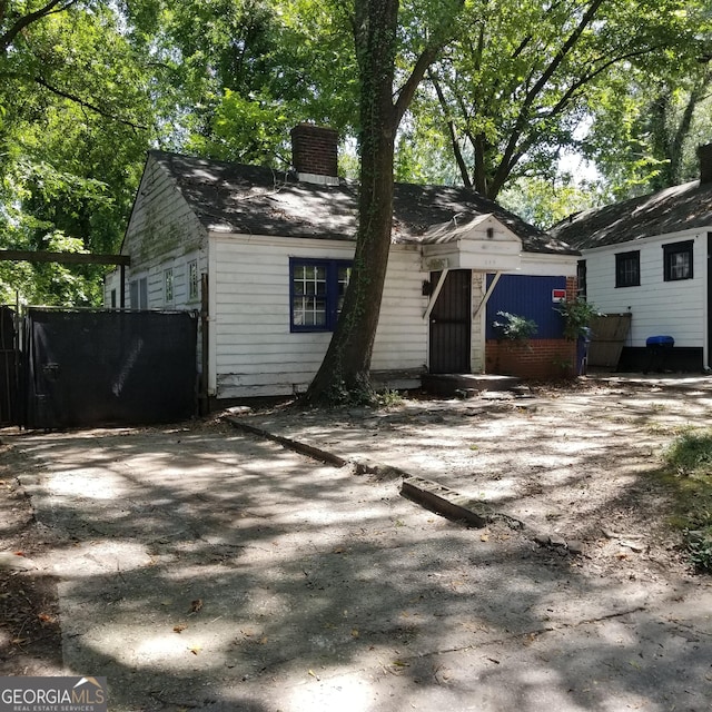 299 Flowers Pl NW, Atlanta, GA 30314 - exterior space featuring fence and a chimney