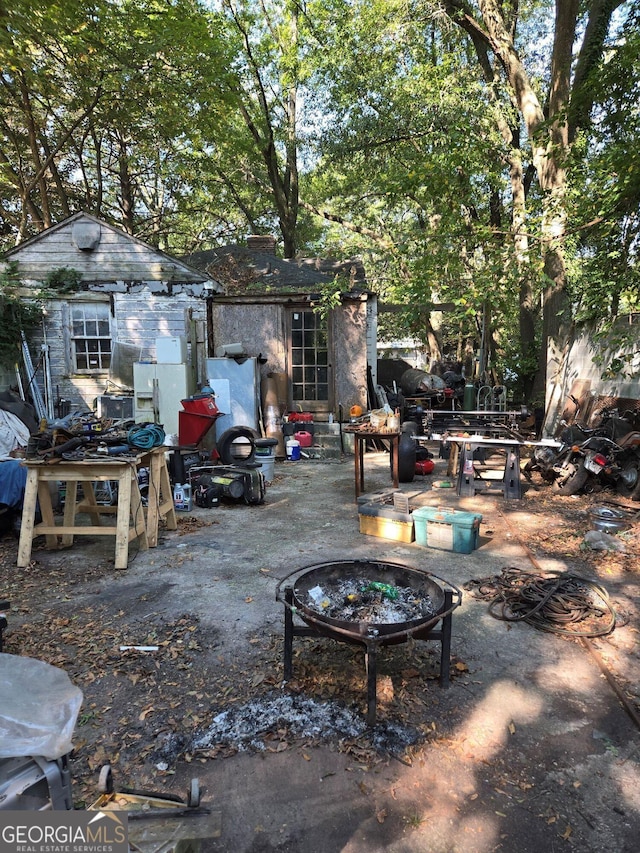 299 Flowers Pl NW, Atlanta, GA 30314 - exterior space featuring an outdoor fire pit and an outbuilding