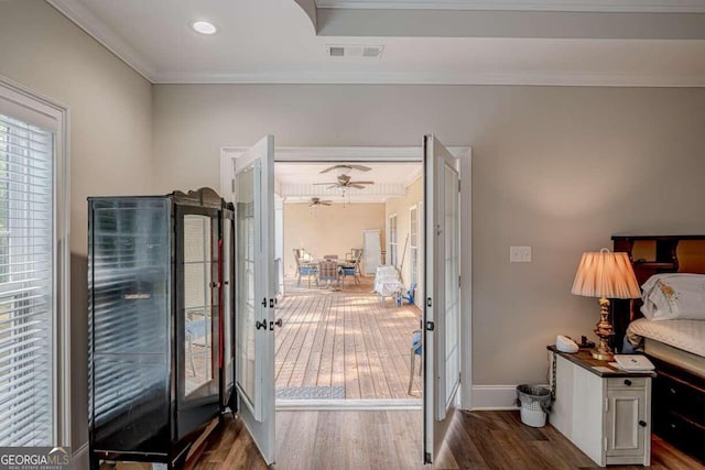 entryway with crown molding and dark hardwood / wood-style floors