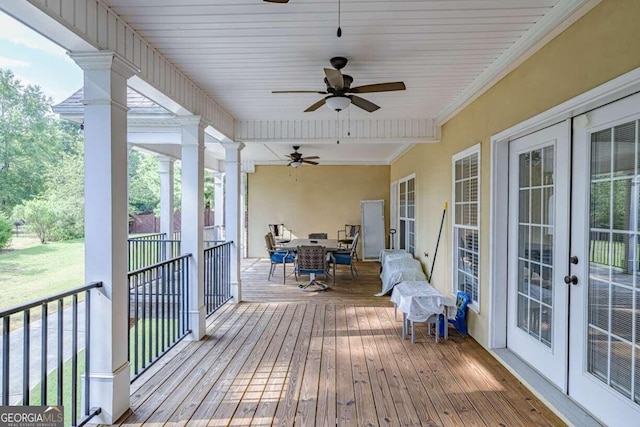 wooden deck featuring ceiling fan