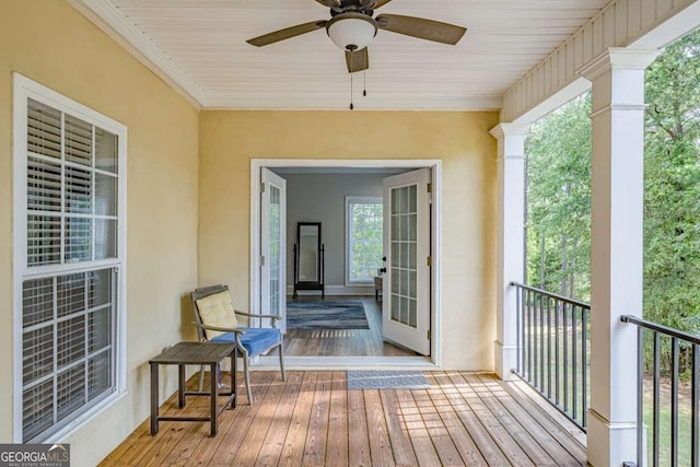 wooden terrace featuring ceiling fan