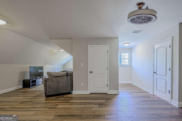 bonus room featuring lofted ceiling and hardwood / wood-style flooring