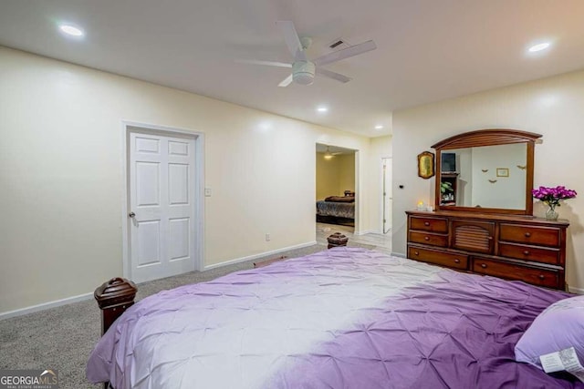 bedroom featuring ceiling fan and light carpet