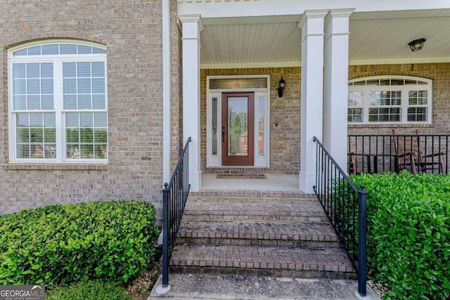 doorway to property with covered porch