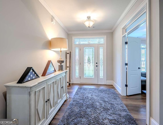 foyer entrance featuring crown molding, a wealth of natural light, and dark hardwood / wood-style floors