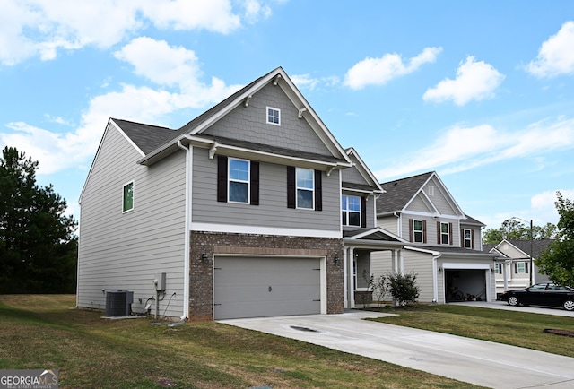 view of front of house featuring a garage, a front yard, and central air condition unit