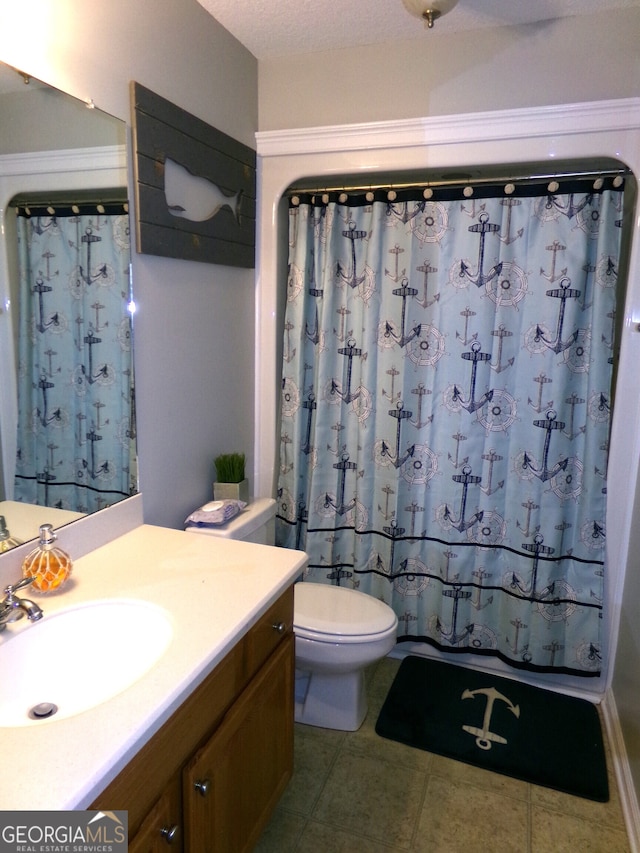 full bathroom with tile patterned flooring, toilet, shower / tub combo with curtain, and vanity