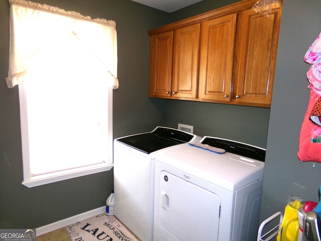 laundry area featuring cabinets and independent washer and dryer