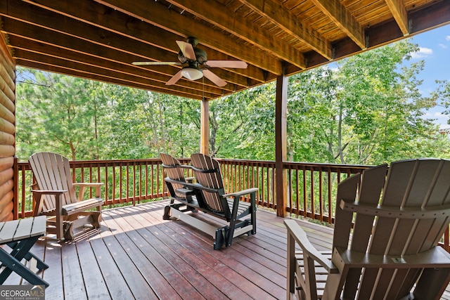 wooden deck featuring ceiling fan