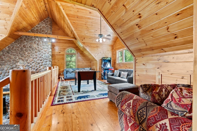 interior space featuring lofted ceiling, hardwood / wood-style floors, ceiling fan, and wood ceiling