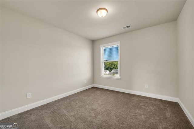 unfurnished room featuring carpet floors