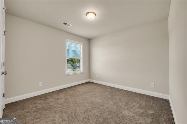 unfurnished room with carpet floors