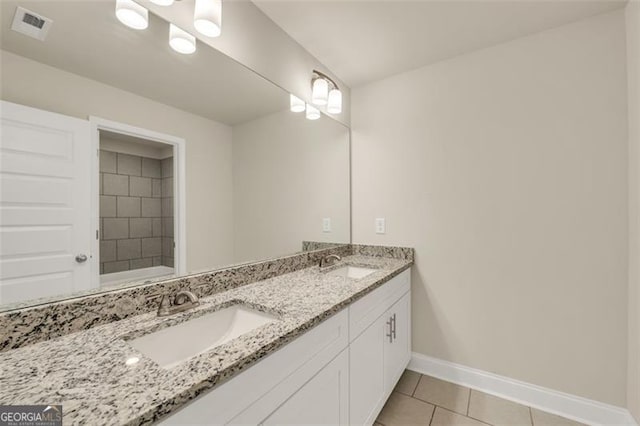 bathroom featuring tile patterned floors and vanity