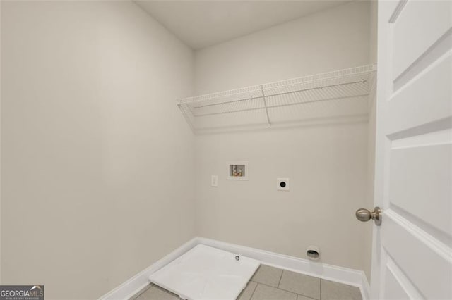 laundry room featuring hookup for a washing machine, electric dryer hookup, and light tile patterned flooring