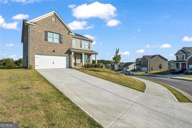 view of front of home with a garage and a front lawn