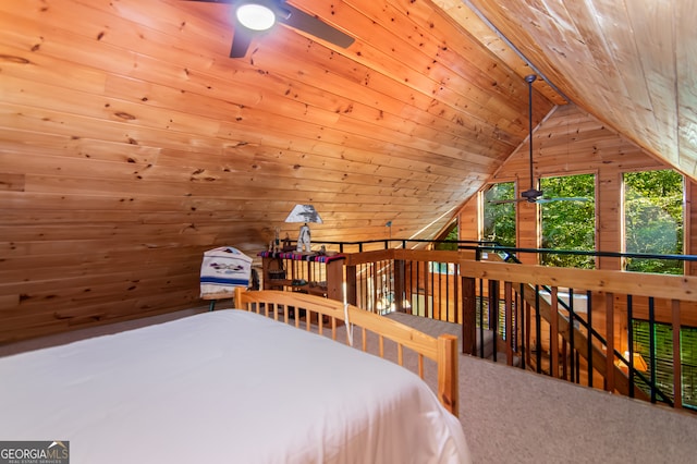 unfurnished bedroom featuring wood ceiling, vaulted ceiling, wood walls, and carpet flooring