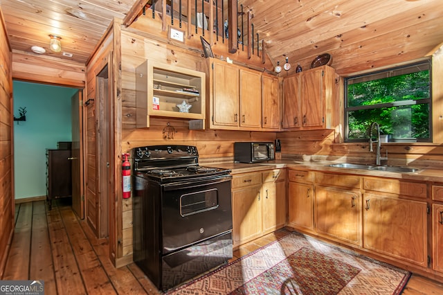 kitchen featuring wooden ceiling, light hardwood / wood-style floors, black electric range oven, and sink