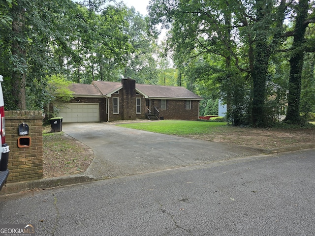 single story home with a front lawn and a garage