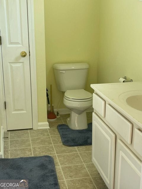 bathroom with toilet and vanity