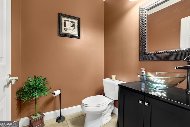 bathroom featuring vanity, toilet, and tile patterned floors