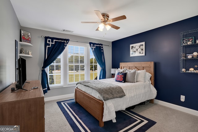 bedroom featuring ceiling fan and carpet