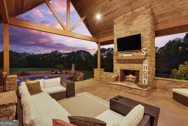 view of patio featuring an outdoor living space with a fireplace