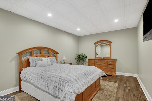 bedroom with wood-type flooring