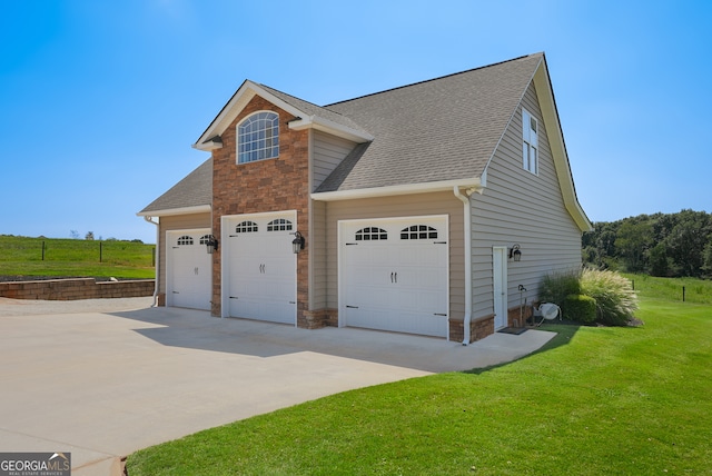 view of side of home featuring a yard