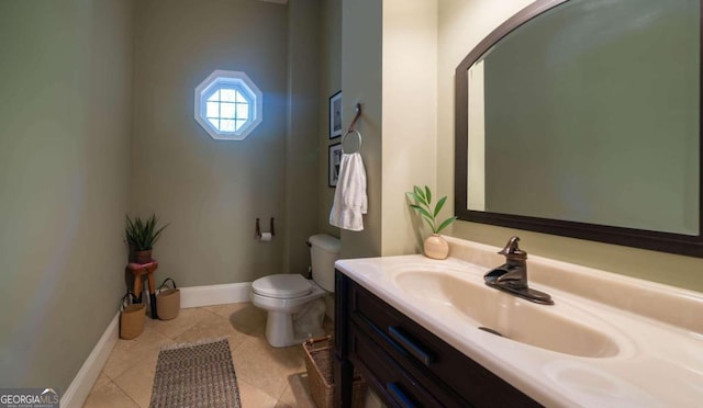 bathroom with tile patterned flooring, toilet, and vanity