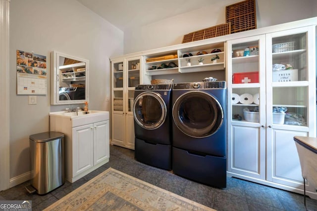 laundry area featuring cabinets and washer and dryer