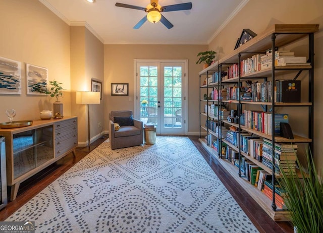 living area featuring crown molding, ceiling fan, dark hardwood / wood-style floors, and french doors