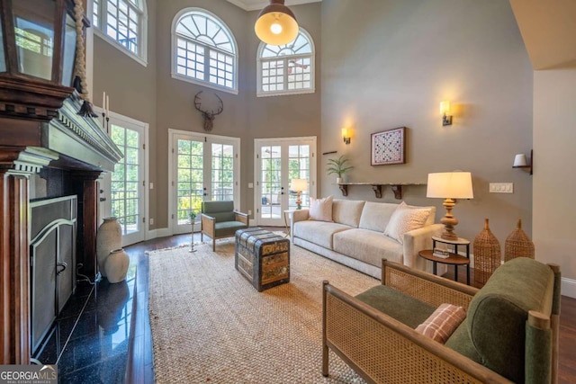 living room with a high ceiling and french doors